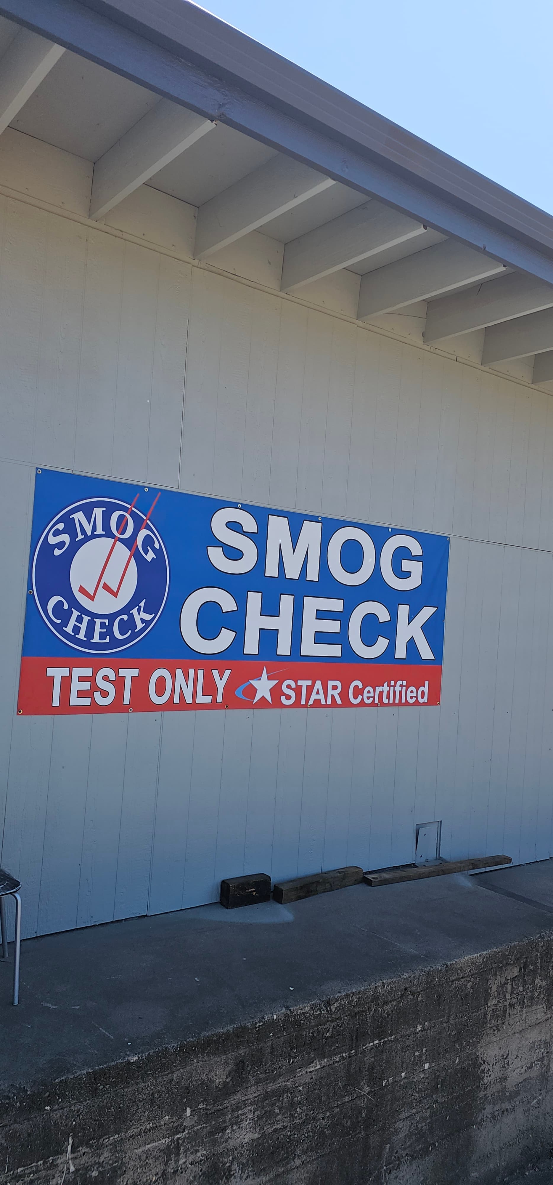 Eco Smog station interior with modern smog check equipment and testing bay