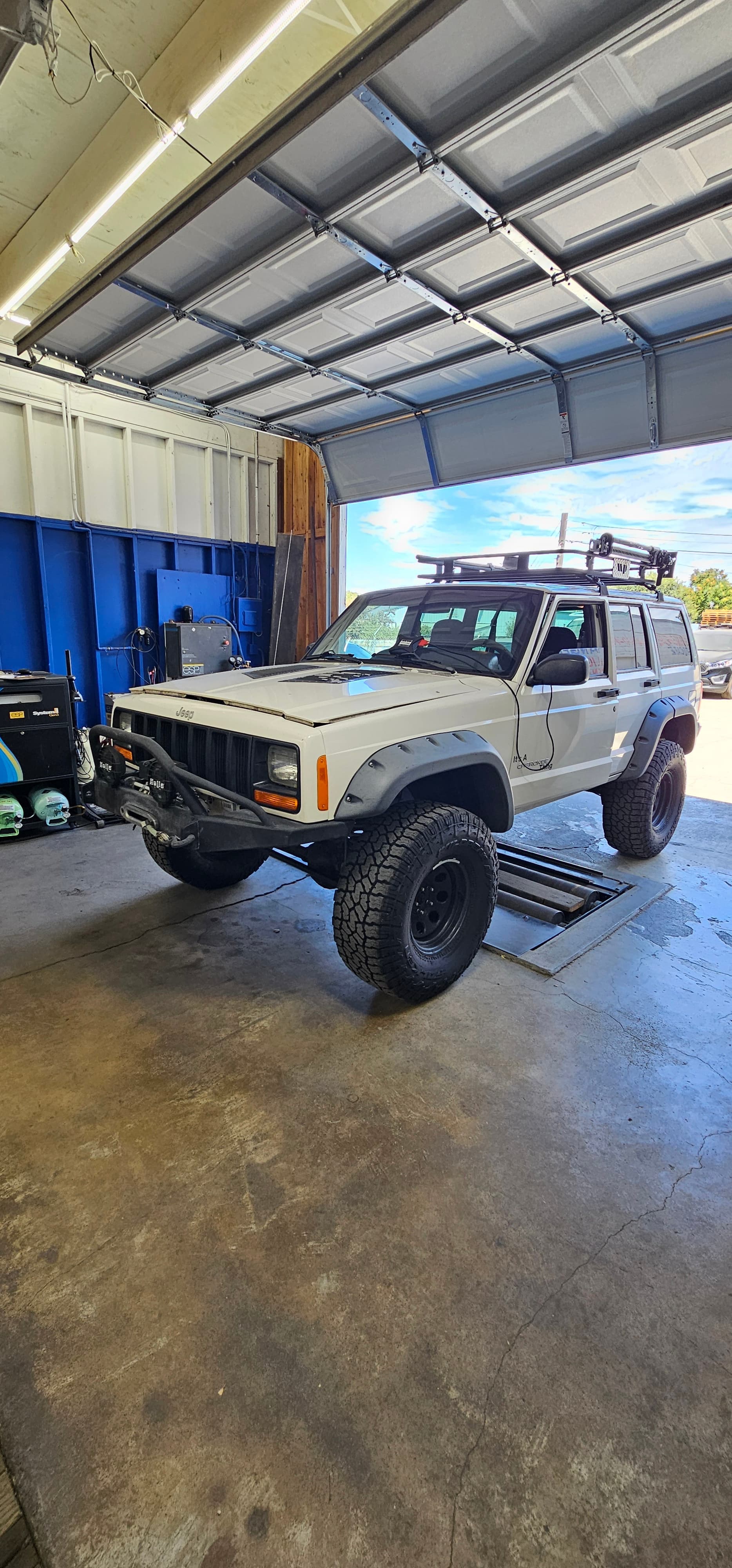 Eco Smog FAQ section showing professional smog check station with modern testing equipment